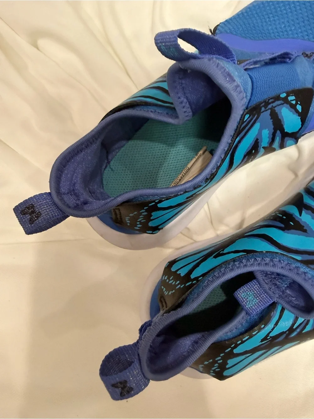 Nike Kids Blue Slip-On Sneakers with Teal and Black Accent
